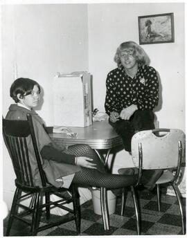 Students seated at a table.