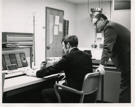 Men sitting at Desk