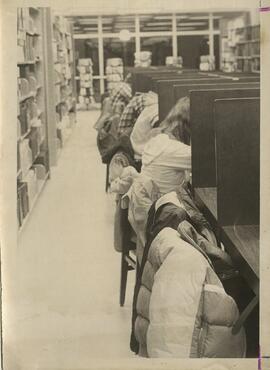 View of students at study carrells in the library.