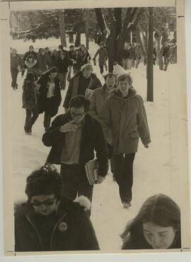 Students walking through the snow.