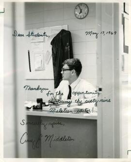 Craig E. Middleton, at a desk, 1969.