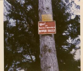 Sign attached to a tree, 1970.