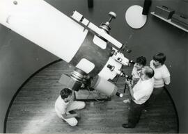 Group looking into large telescope