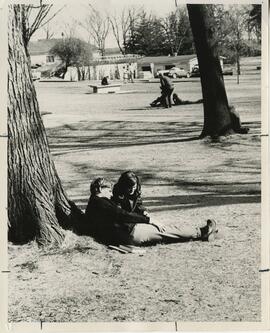 Students hanging out on grass, 1968.