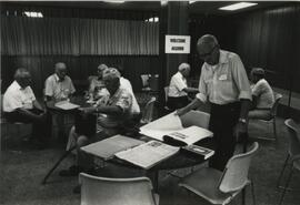 Men Looking at Books, 1988.