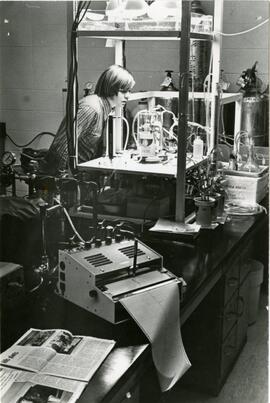Student looking at science equipment