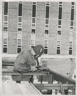 Person working on construction of agricultural science hall