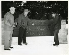 Employees installing the new Wisconsin State University Sign, 1964.