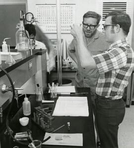 Pair looking at a beaker