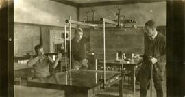 Student holding a gun in lab