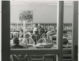 View of students in the library reading room, circa 1970's.