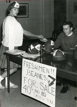 Student buying a freshman beanie, 1950-1970