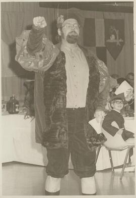 Man standing in costume.