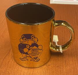 Gold mug, Freddy Falcon, NRHH (National Residence Hall Honorary)