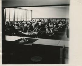 View of students in the library reading room, circa 1960's.