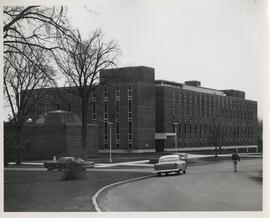 Cars and student outside agricultural science hall