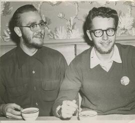 Two male student seated at a table, 1956-1957.