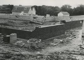Construction in front of a barn