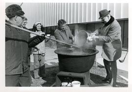 Serving bean soup.