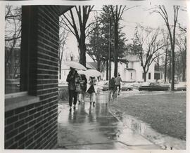 walking across campus in the rain