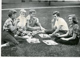 Students eating on the grass, 1955.