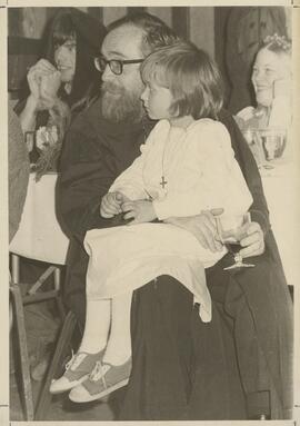 Child and man at Madrigal Banquet.