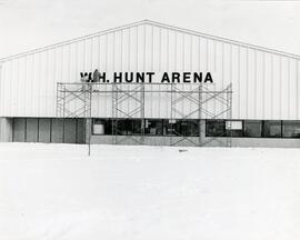 Installing sign on Hunt Arena, 1972.