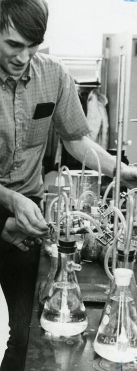 Student using beakers and other equipment