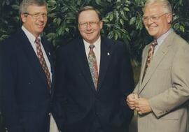 Three men in suits.