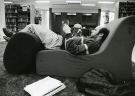 Student reading in the library, 1987.