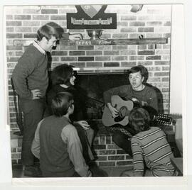 Student playing a guitar.