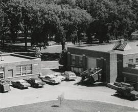 Cars parking outside industrial arts building