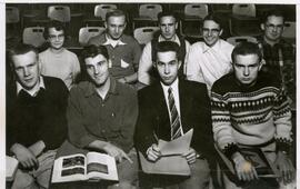 Group of students sitting in desks.