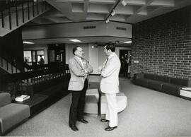 People talking in Centennial Science Hall