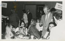 Dr. Richard Swensen talks with people at an Alumni event.