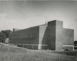 Side view of agricultural science hall with man on roof