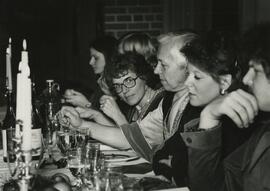 People at table at Madrigal Banquet.