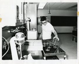 Person holding lab equipment