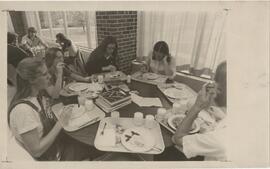 People in Rodli Commons eating at table