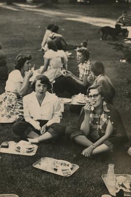 Women students seated on the grass, 1955.