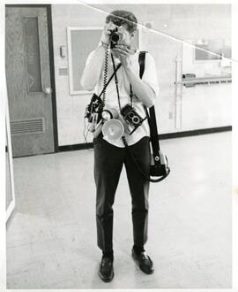 Dean Madson with cameras, 1968.