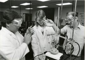 Three people in safety goggles