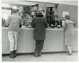 Students at the library reserve desk, circa 1950s.