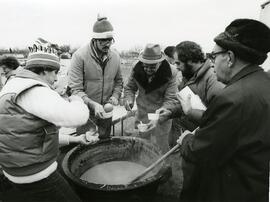 Serving bean soup.