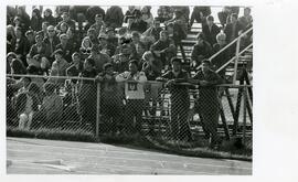 Spectators at a football game, no date.