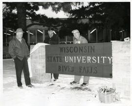 Employees installing the new Wisconsin State University Sign, 1964.