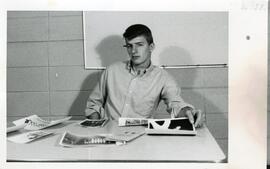 H. O'Brien sitting at desk, 1968.