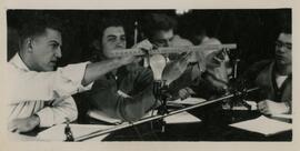 Students with a ruler and lightbulb