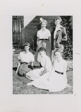 Women students seated on the grass, 1955.