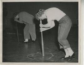 Students spinning with baseball bat, 1949.